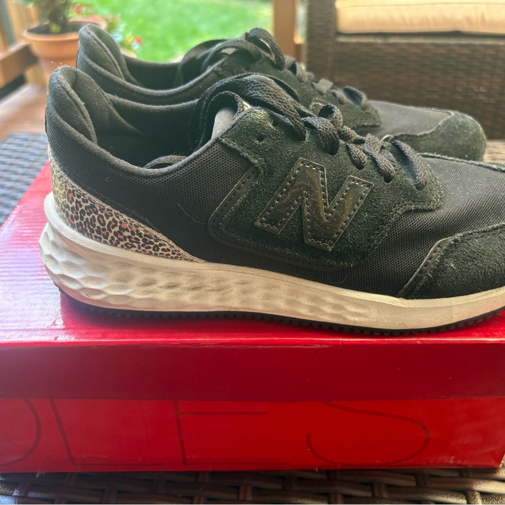 New Balance Black Athletic Sneakers with Leopard Heel Accent